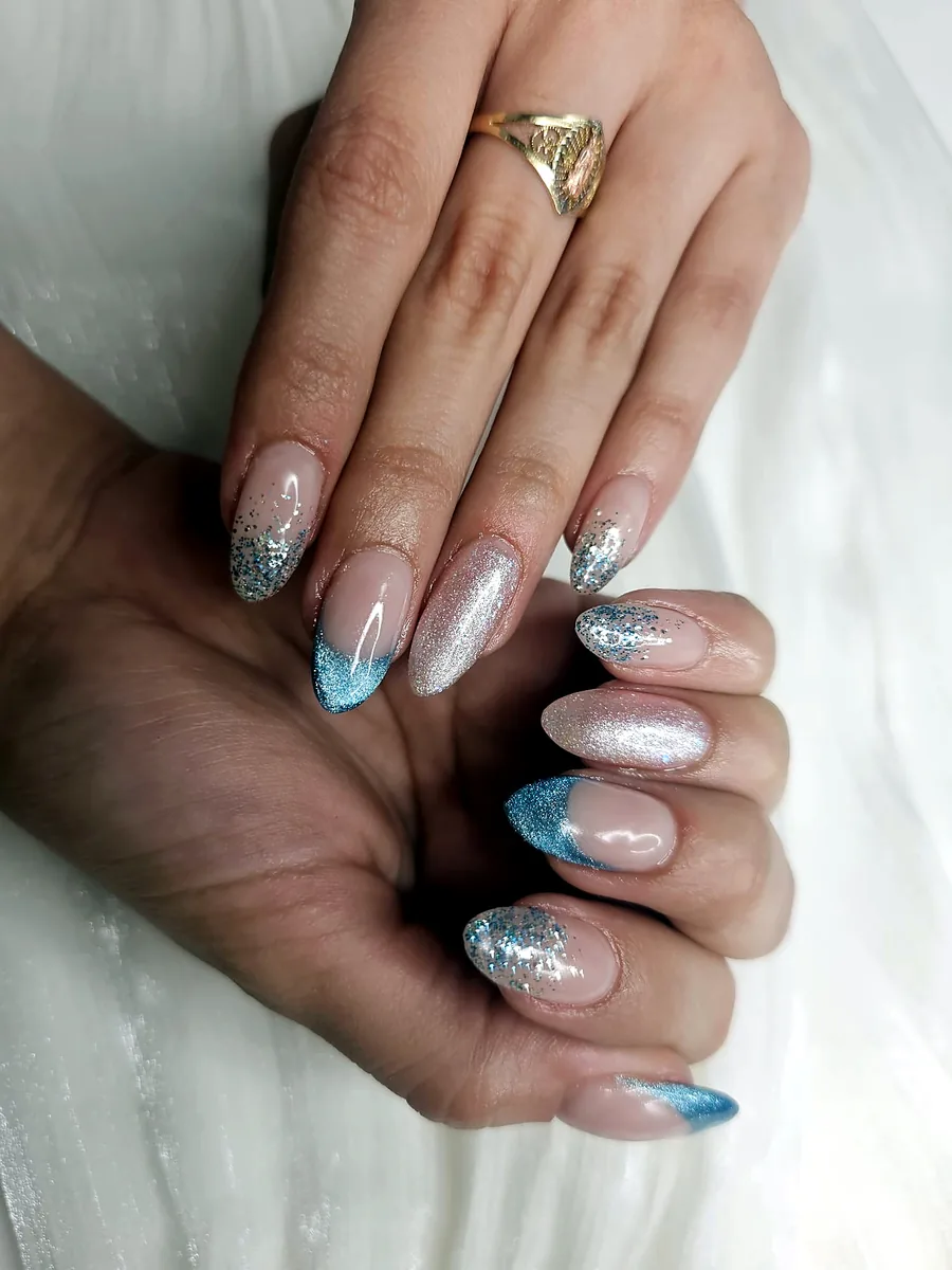 Almond nails in ice blue and silver glitter with French tips