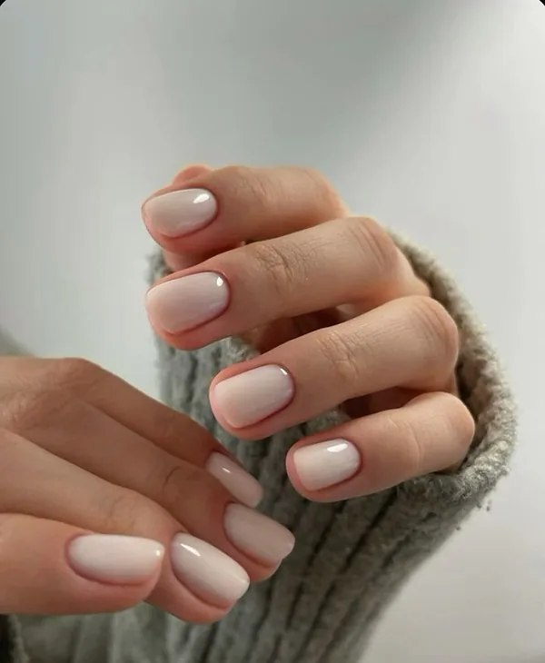 Short natural nails in a soft milky nude gel